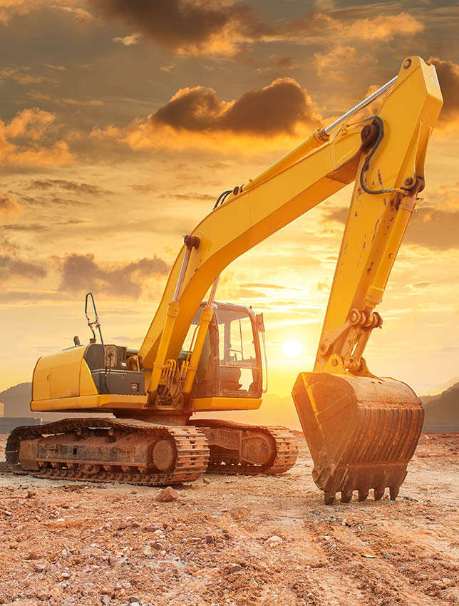 Heavy earth mover with blue sky in the background